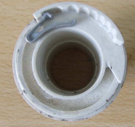 The rotating half of the MRX. The white part contains the ratchet, and the spring is placed next to it.