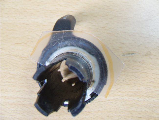 A transparent piece of plastic is placed on top of the fixed part of the shifter